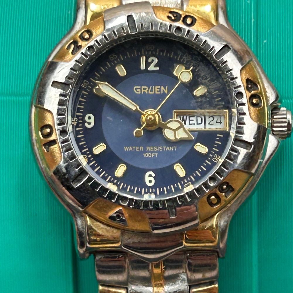 Gruen GR213 Two Tone Blue Dial Day Date Rotating Bezel Quartz‎ Watch